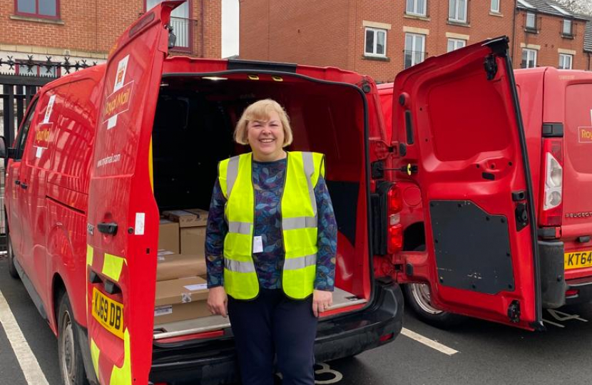 Jane with a Royal Mail van.