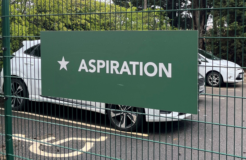 A poster which reads 'Aspire'