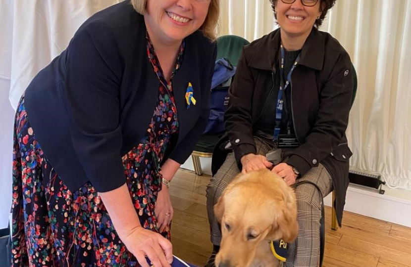 Jane Hunt MP with a Guide dog
