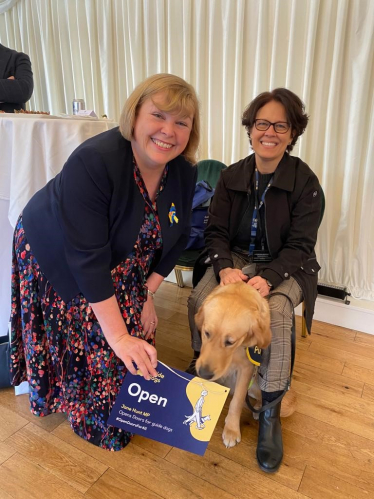 Jane Hunt MP with a Guide dog